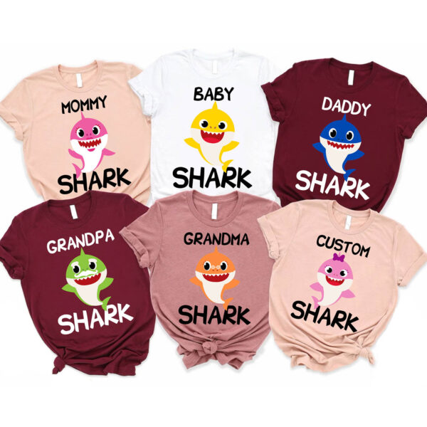 a group of shirts with shark designs